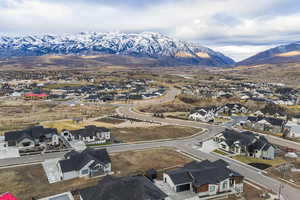 Aerial view of residential area featuring a mountainous background