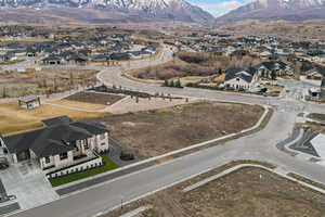 View of property location featuring nearby suburban area and a mountain backdrop