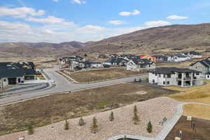 Aerial view of residential area featuring a mountainous background