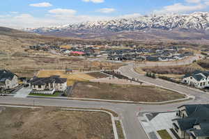 Aerial view of residential area featuring a mountainous background