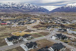 View of property location with nearby suburban area and mountains