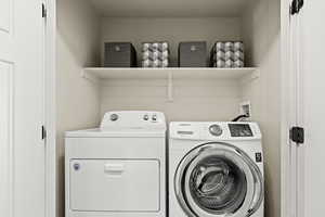 Laundry area featuring separate washer and dryer