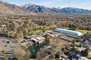 Aerial view of property's location featuring a water and mountain view