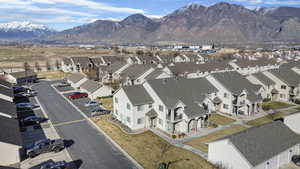 Aerial view of residential area featuring mountains