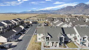 Aerial perspective of suburban area featuring a mountain backdrop