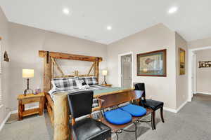 Bedroom featuring light carpet and recessed lighting