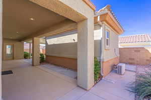 View of patio and mini-split behind casita
