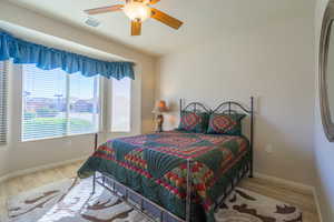 2nd Bedroom with LVP flooring, bay windows  and a ceiling fan