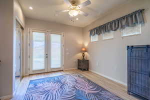 Entryway with french doors, ceiling fan, recessed lighting, LVP finished floors,