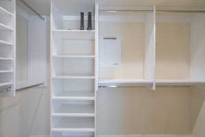 View of walk in closet with organizers