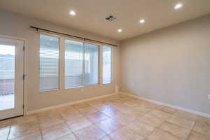 Unfurnished room featuring recessed lighting and baseboards