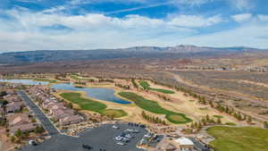 Aerial view of residential area with a water and mountain view and a golf club