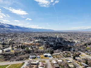 Aerial perspective of suburban area featuring a mountain backdrop