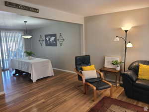 Living area with wood-type flooring and baseboards