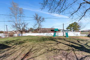 View of yard featuring a playground