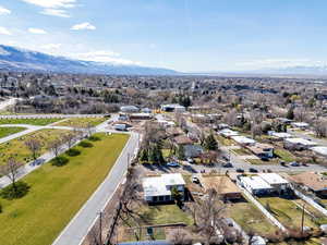 Aerial perspective of suburban area with a mountain backdrop