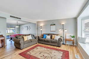 Living area with light wood-type flooring