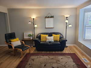 Living area featuring wood finished floors and baseboards