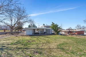 Rear view of house featuring a patio
