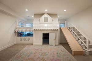 Living area featuring carpet and recessed lighting