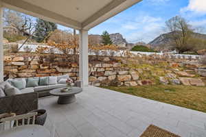 View of patio / terrace featuring a mountain view and an outdoor living space