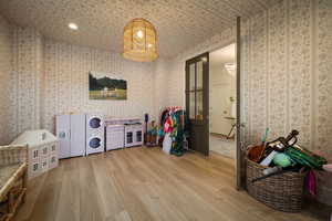 Playroom with light wood-style floors, recessed lighting, and washer / clothes dryer