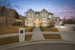 View of front of home featuring driveway and covered porch