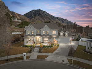 Traditional-style home featuring covered porch, driveway, and a mountain view