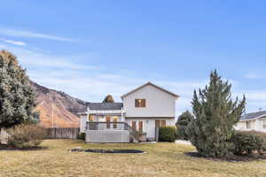 Rear view of property with a wooden deck