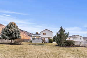 Rear view of property with a deck