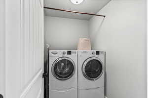 Laundry area featuring separate washer and dryer