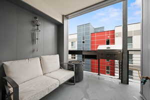 Balcony featuring area for grilling, first level