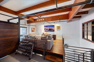 Living area with hardwood / wood-style floors and a barn door