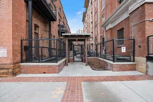 View of exterior entry featuring a security gate (primary entrance)