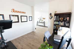Office featuring light wood-type flooring and baseboards