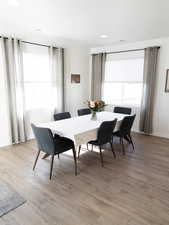 Dining space featuring light wood finished floors and recessed lighting