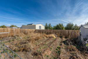 View of fenced backyard