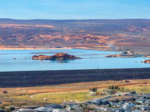 Water view featuring nearby suburban area and a mountainous background