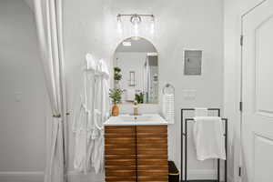 Bathroom featuring vanity and baseboards