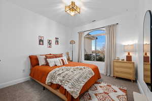 Carpeted bedroom with baseboards