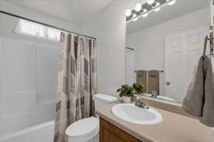 Bathroom with vanity and shower / bath combo