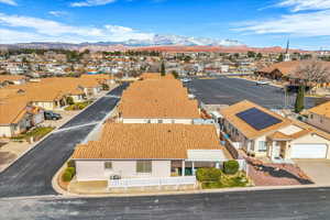Aerial perspective of suburban area featuring a mountainous background