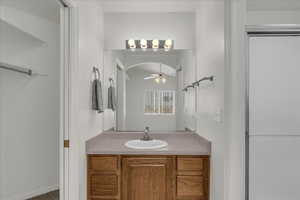 Bathroom with vanity and a ceiling fan