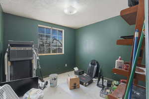 Misc room with a textured ceiling