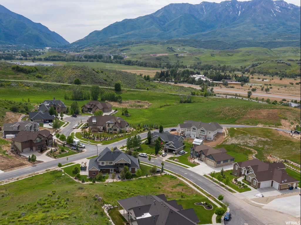 Aerial perspective of suburban area featuring a mountain backdrop
