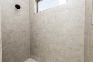 Full bath with a tile shower