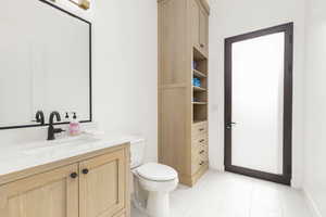 Bathroom featuring vanity and light tile patterned flooring
