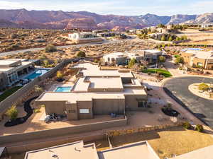 Aerial perspective of suburban area with a mountain backdrop