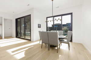 Dining area featuring light wood finished floors and baseboards