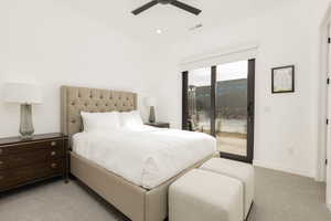 Bedroom featuring light colored carpet, access to exterior, a ceiling fan, and recessed lighting